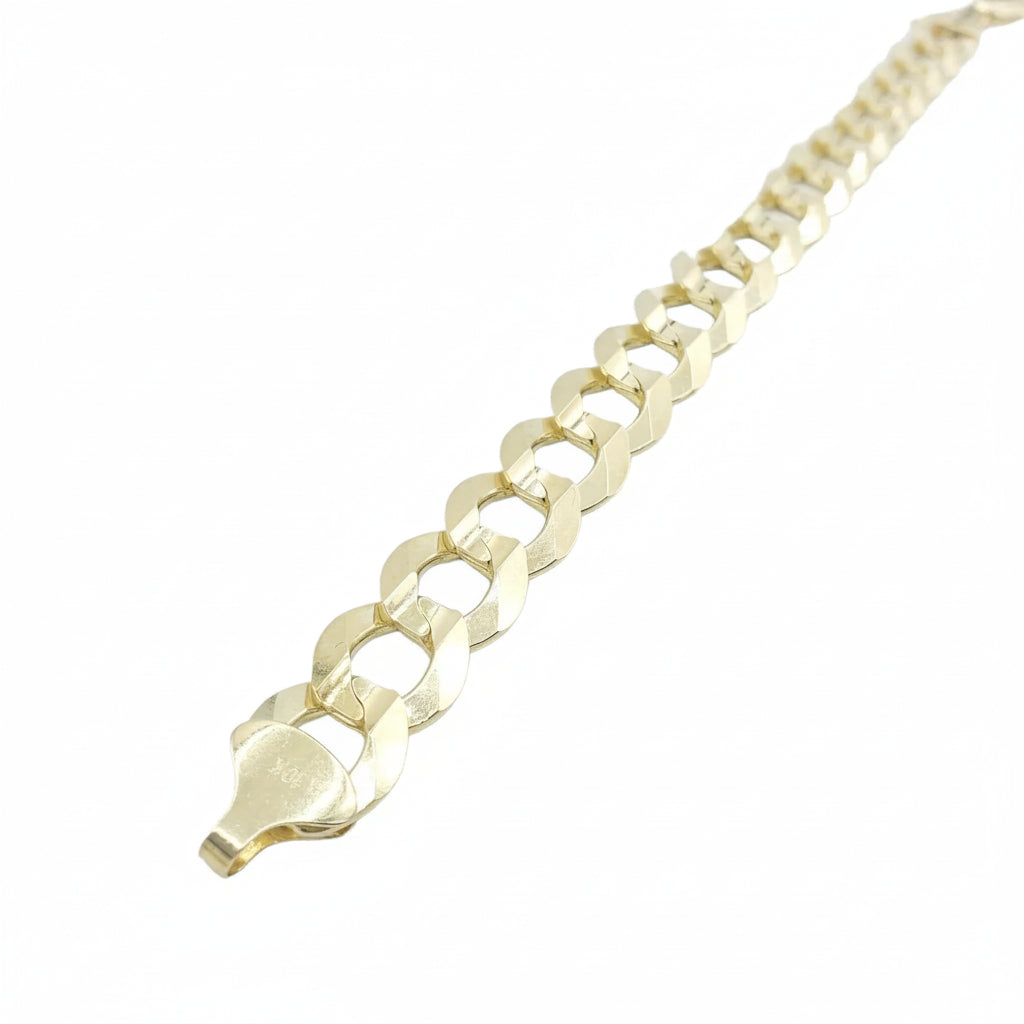 A close-up of a gold Cuban link chain bracelet, showing the polished metal links and clasp, set against a plain white background.