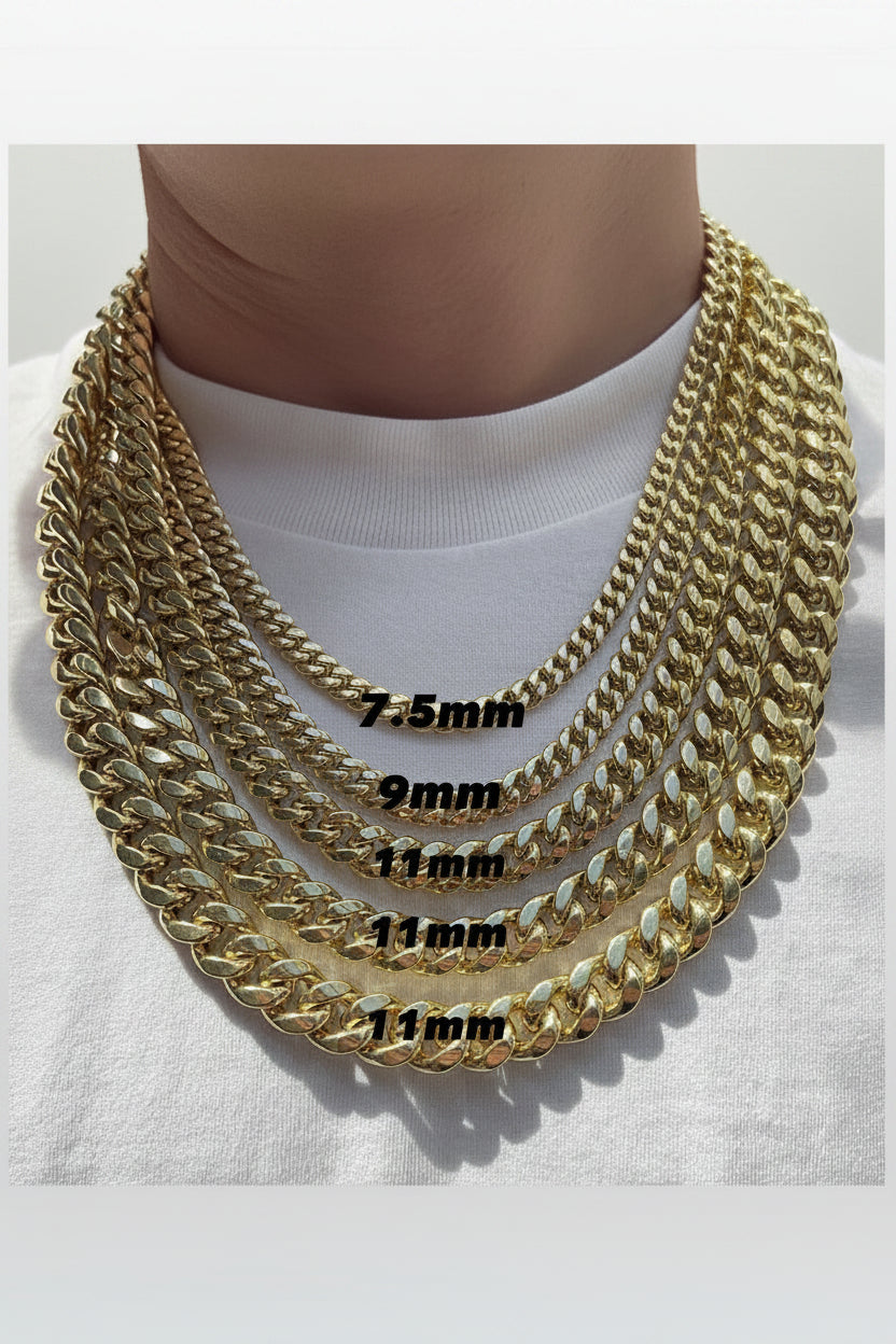 Gold chain necklace with size measurements on a white shirt