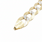 A close-up of a gold chain bracelet with clear faceted gemstones set between the links, photographed on a plain white background. The end link is stamped with '10K'.