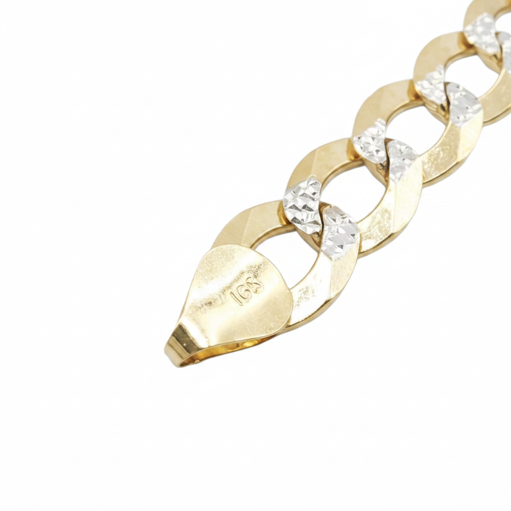 A close-up of a gold chain bracelet with clear faceted gemstones set between the links, photographed on a plain white background. The end link is stamped with '10K'.