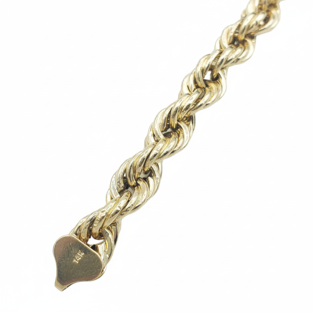 A close-up of a gold rope chain bracelet with a heart-shaped tag engraved with '14K', set against a plain white background.