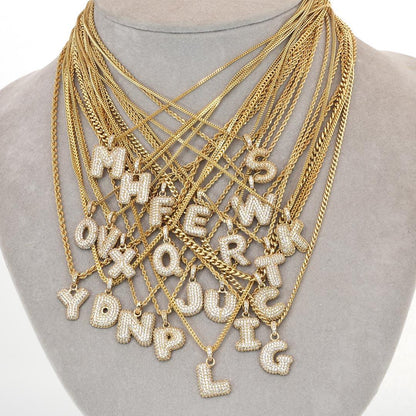 medalla de letras bubble letter en oro 14k