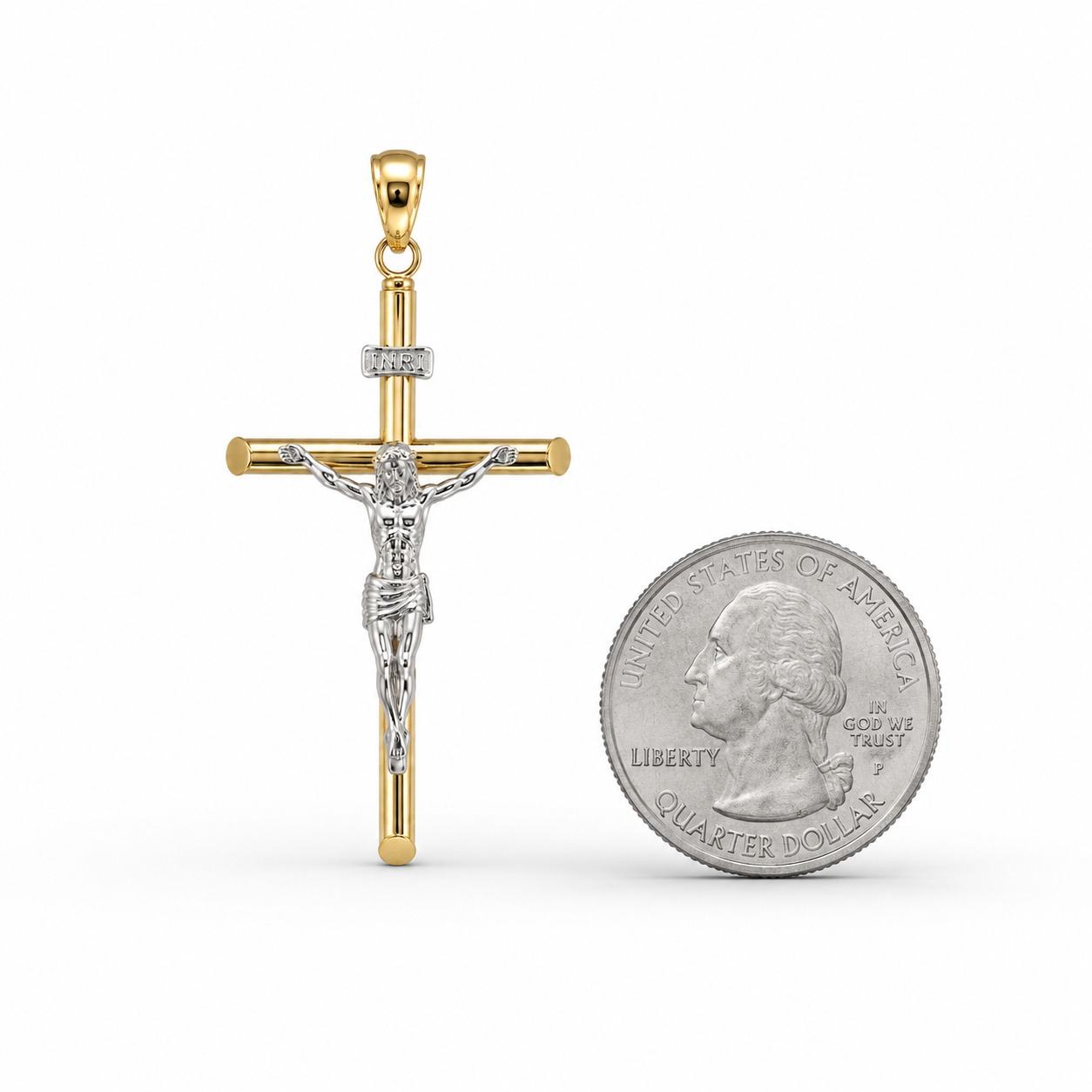A two-tone gold and silver crucifix pendant displayed next to a US quarter coin for scale, on a clean white background.