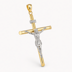 A gold and silver crucifix pendant with a silver-toned corpus featuring a detailed figure of Jesus Christ, accented with small clear stones on the crossbar and beam, shown on a light gray background.