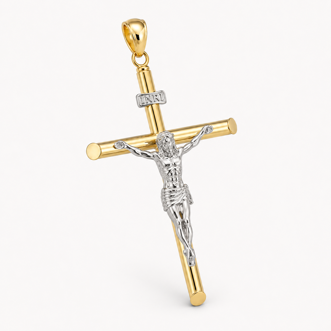 A gold and silver crucifix pendant with a silver-toned corpus featuring a detailed figure of Jesus Christ, accented with small clear stones on the crossbar and beam, shown on a light gray background.