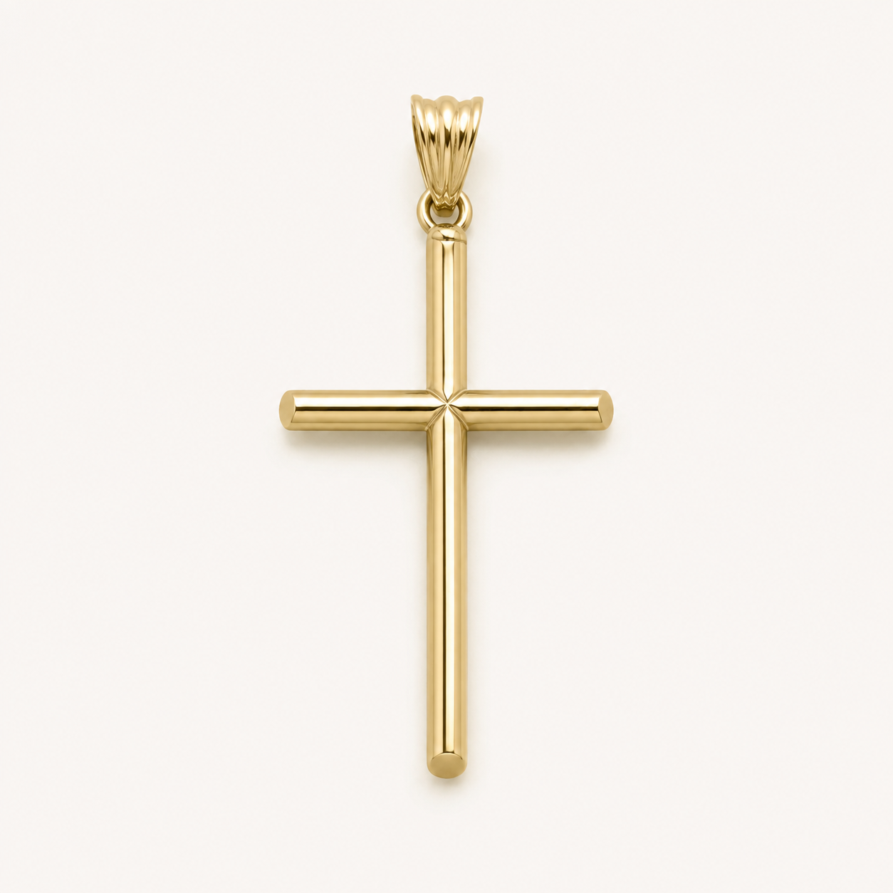 A polished yellow gold cross pendant with a smooth, rounded design and a decorative bail, shown against a clean off-white background.