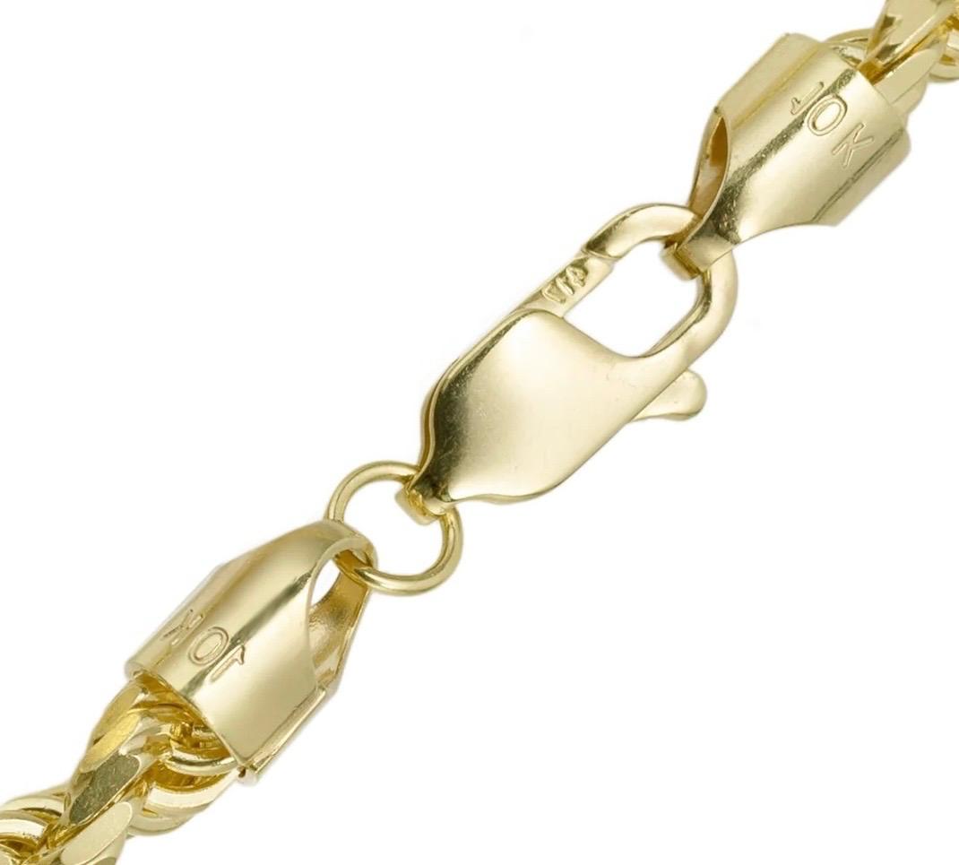 Close-up of a yellow gold chain bracelet showing a lobster clasp and matching connector links on a plain white background.